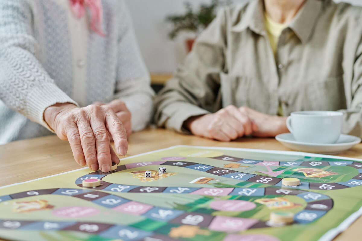 Dementia Care, Cognitive Activities; two senior women playing a board game
